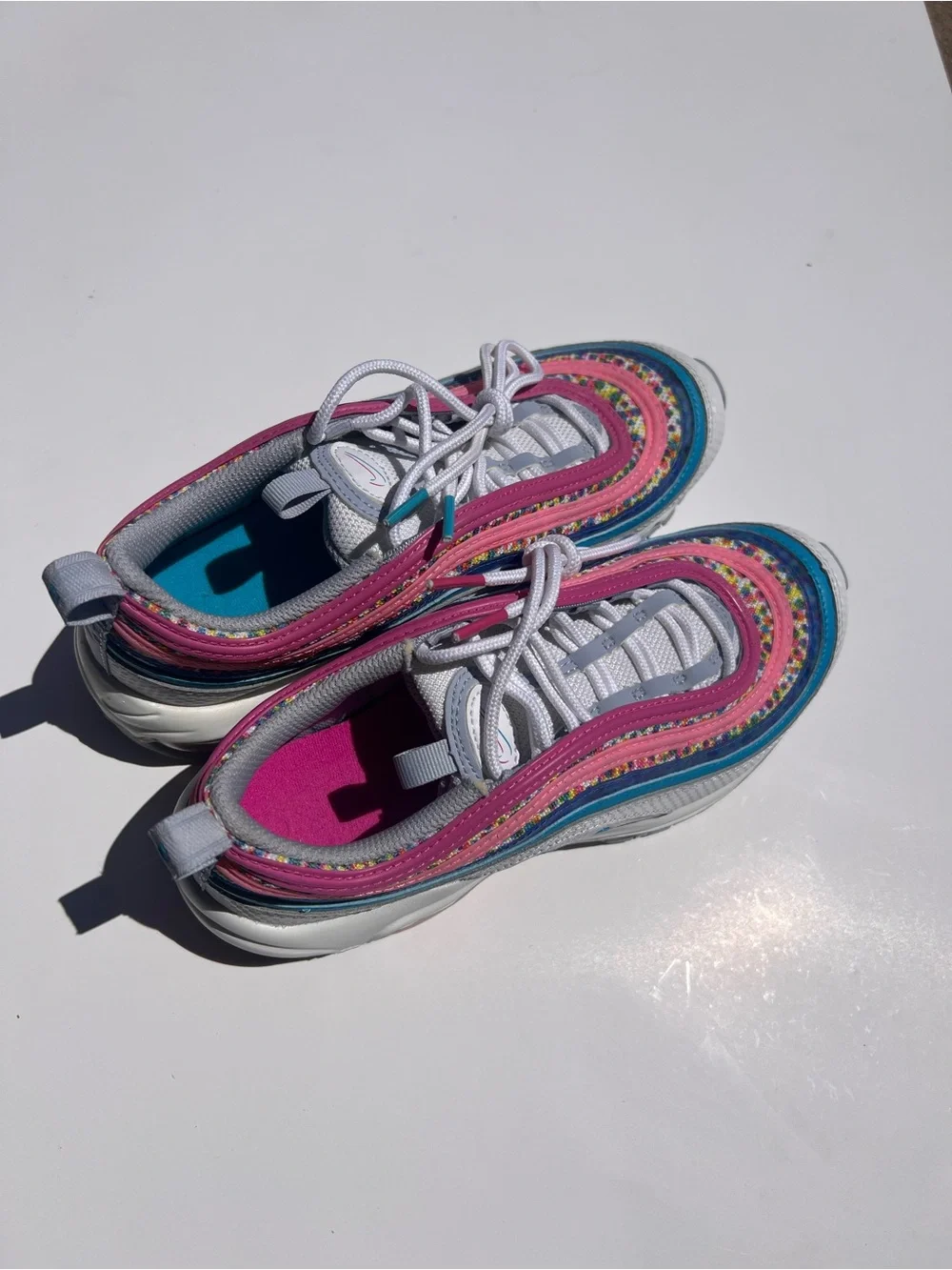 Nike Kids White Sneakers with Pink and Teal Accents